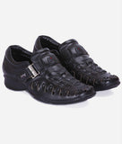 Black men's Roman sandal with alligator design and buckle closure, flat PU sole, and medium width, stylish synthetic footwear.