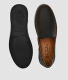 Black men's slip-on loafer shoes with perforated synthetic leather upper and rubber sole, flat heel design for comfort and breathability.