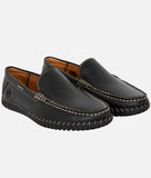 Black men's casual loafer with synthetic leather, slip-on design, flat rubber sole, and contrast stitching