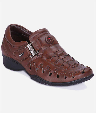 roman sandal in reddish-brown textured synthetic leather with woven cutout panels, buckle detail and black soles