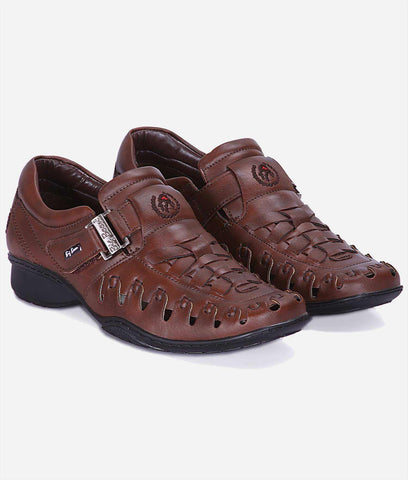 roman sandal in reddish-brown textured synthetic leather with woven cutout panels, buckle detail and black soles