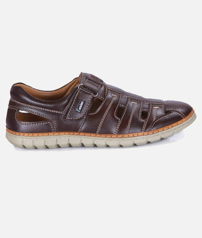 sandal in dark brown synthetic leather with stitched panels, closed toe and cutout sides on a light sole